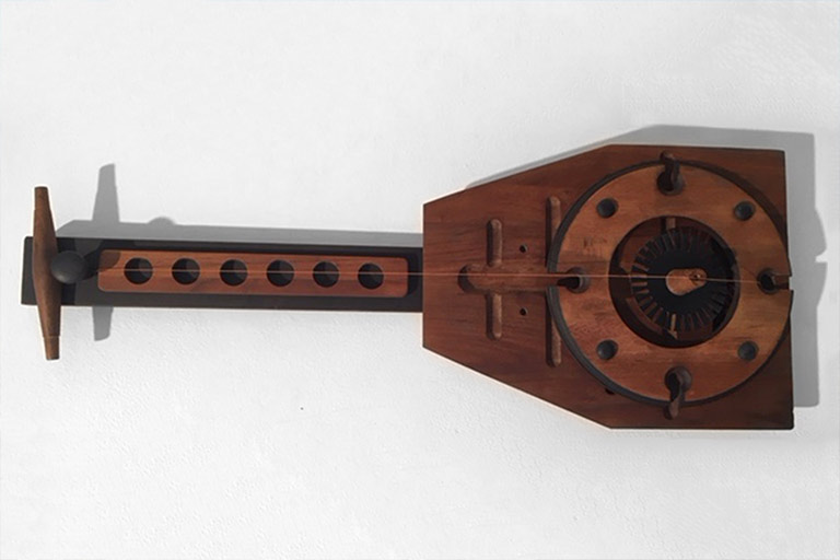 A wooden, folk art guitar