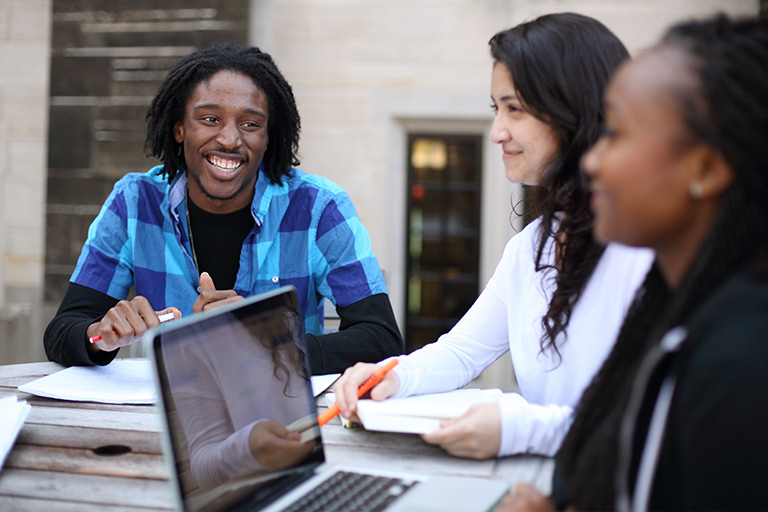 A study session between three students on the Bloomington campus.