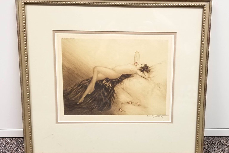 'Love's Knocking' by Louis Icart features a young, 1930's woman outstretched on a bed of furs. This original etching is matted and framed.